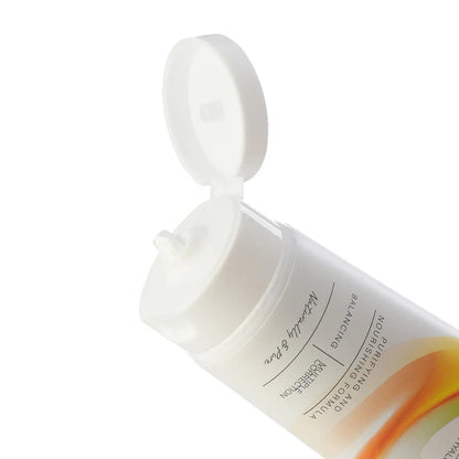 Close-up of Puramoria Facial Cleanser texture, infused with Salicylic Acid and Hyaluronic Acid for hydration.